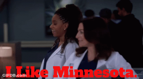 Two Women In White Coats With The Words I Like Minnesota On The Top GIF