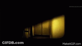 Two Women In White Dresses In Dark Room GIF