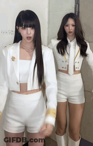 Two Women In White Shorts And Jackets GIF