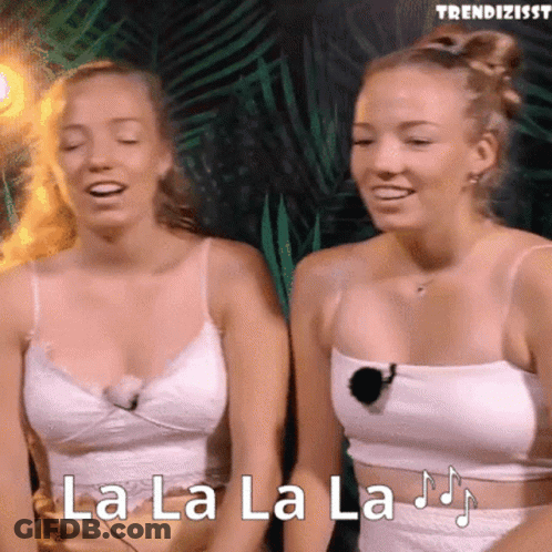 Two Women In White Tank Tops Are Singing La La La La .. GIF