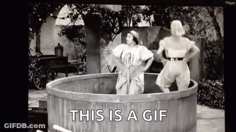 Two Women In Wooden Tub Saying This Is A GIF