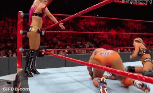 Two Women In Wrestling Ring One Kneeling GIF