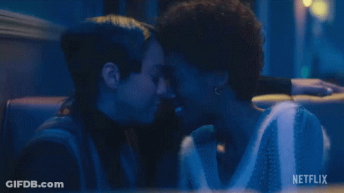 Two Women Kissing Dark Room Netflix Logo GIF