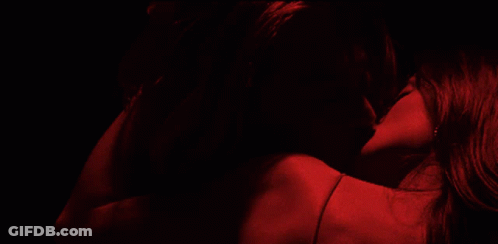 Two Women Kissing In Dark Room With Red Lights GIF