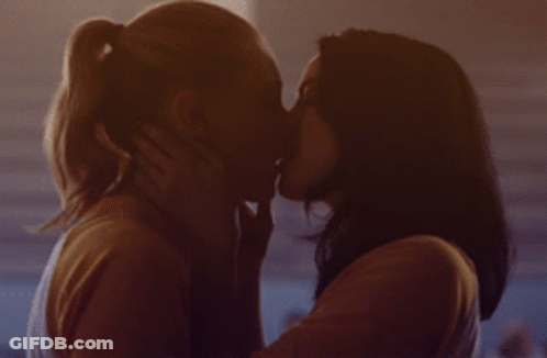 Two Women Kissing In Dark Room GIF