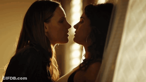 Two Women Kissing In Dark Room GIF