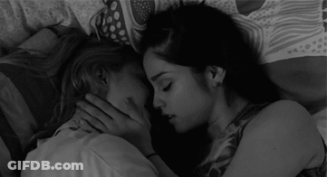 Two Women Kissing On Bed GIF