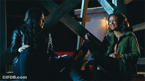 Two Women Laughing On Stairs GIF