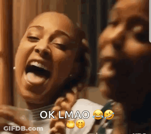 Two Women Laughing One Holding Cell Phone GIF