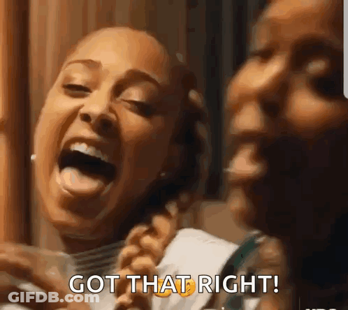 Two Women Laughing One Holding Glass Of Water GIF