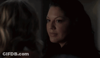 Two Women Laying On Bed Kissing In Dark GIF