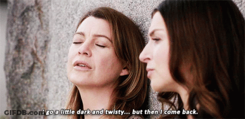 Two Women Leaning Against A Wall With One Saying " I Go A Little Dark And Twisty But Then I Come Back GIF