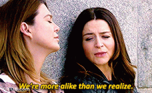 Two Women Leaning Saying We're More Alike GIF