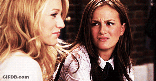 Two Women Looking At Each Other Making Face GIF