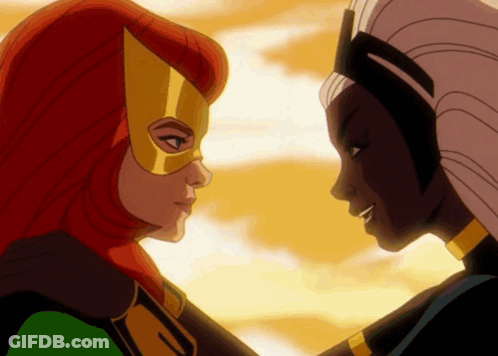 Two Women Looking At Each Other One Wearing Mask GIF