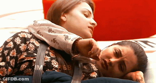 Two Women Lying Next To Each Other GIF
