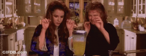 Two Women Making Drink In Kitchen GIF