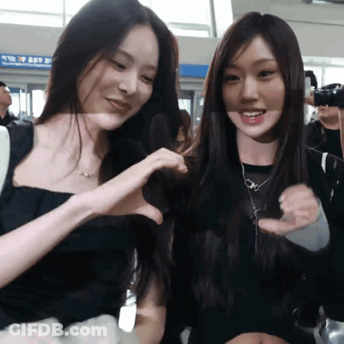 Two Women Making Heart With Hands GIF