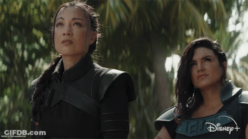 Two Women Next To Disney Logo GIF