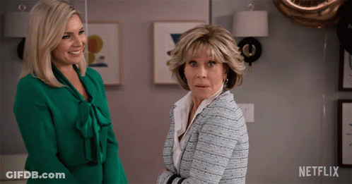 Two Women Next To Netflix Logo GIF