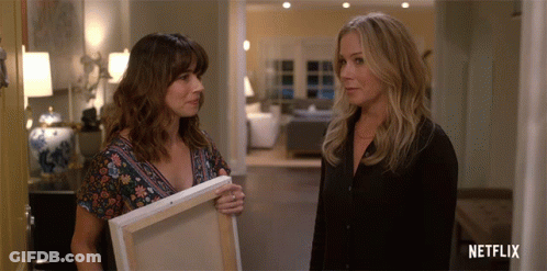 Two Women Next To Netflix Logo GIF
