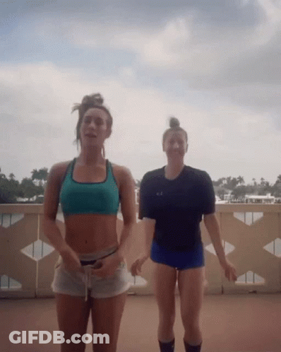 Two Women On Balcony One In Black Under Armour GIF