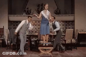Two Women On Balcony, One In Black Under Armour GIF