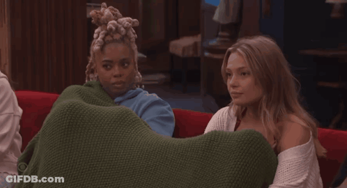 Two Women On Couch Saying I Am Sat GIF