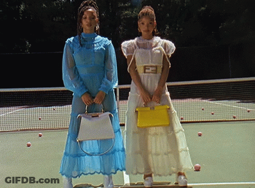 Two Women On Tennis Court With Yellow Bag F GIF