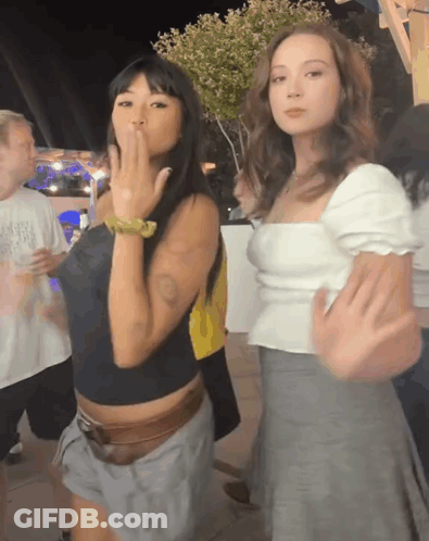 Two Women One Blowing A Kiss GIF