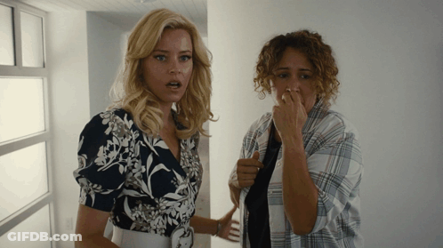 Two Women One Covering Nose GIF