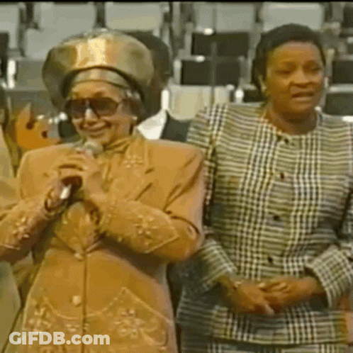 Two Women One Holding Microphone GIF