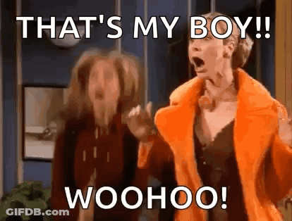 Two Women One In Orange Fur Coat GIF