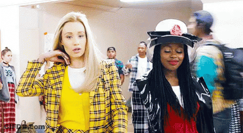 Two Women One In Yellow Plaid Jacket GIF
