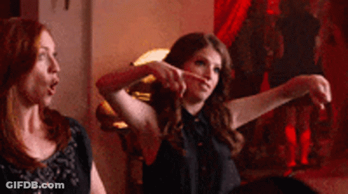 Two Women One Pointing At Camera GIF