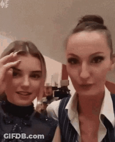 Two Women One Touching Eyebrow GIF