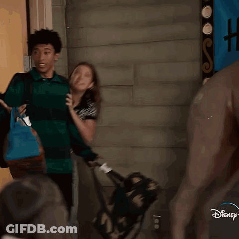 Two Women One Wearing Disney Shirt GIF