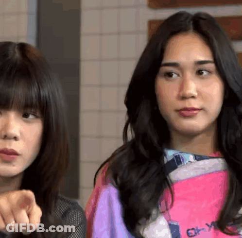Two Women One Wearing Pink Shirt Saying Enjoy GIF