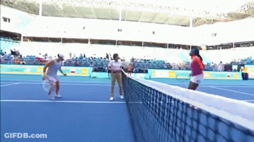 Two Women Playing Tennis GIF