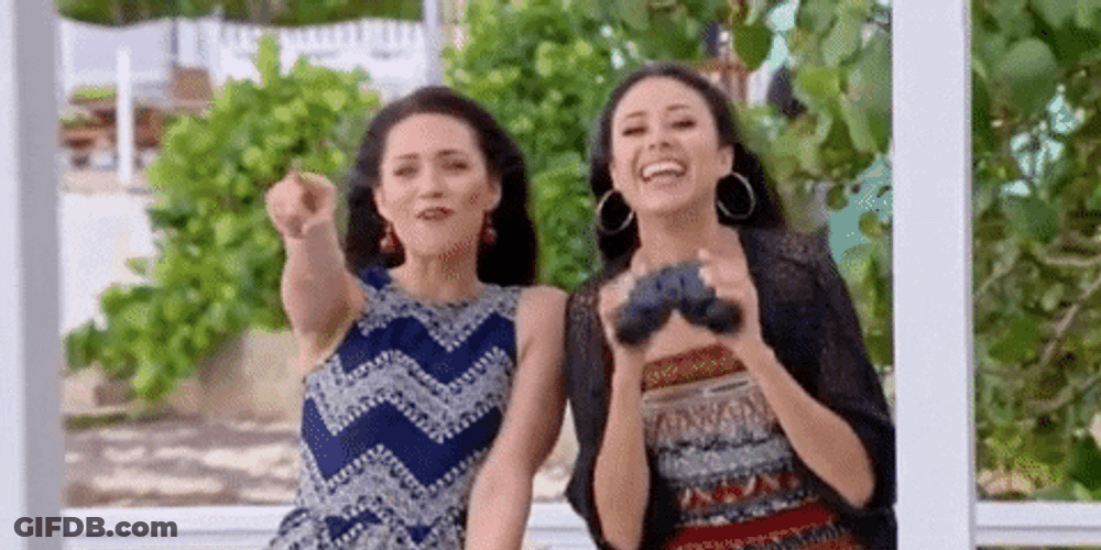 Two Women Pointing GIF