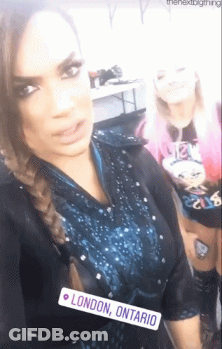 Two Women Posing, One Has London Ontario Tag GIF