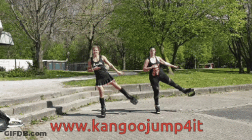 Two Women Rollerblading In A Park With The Website Www.kangoojump4it In The Corner GIF