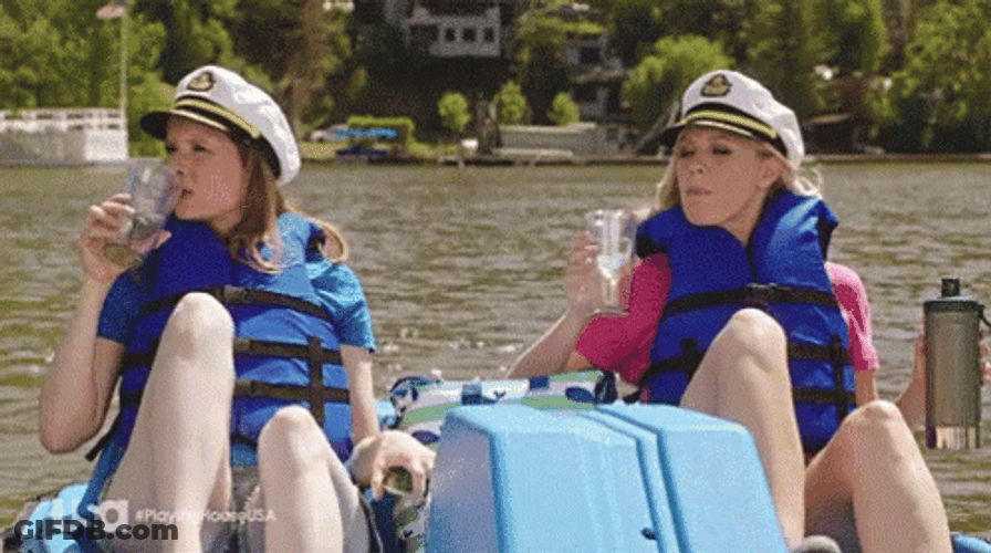 Two Women Row The Boat With Their Feet GIF