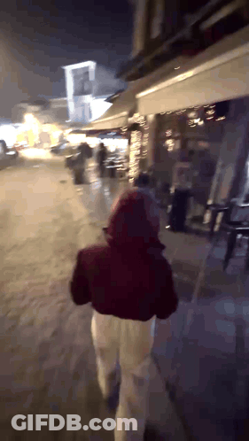 Two Women Running In Woods One With Heart Shirt GIF