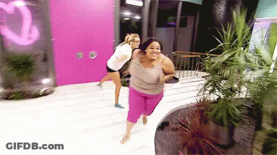 Two Women Running Past Pink Door Saying Q GIF
