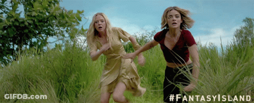 Two Women Running Through A Grassy Field With The Hashtag #Fantasyisland GIF