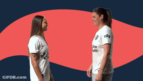 Two Women Shaking Hands With One Wearing A Shirt That Says Ally On It GIF