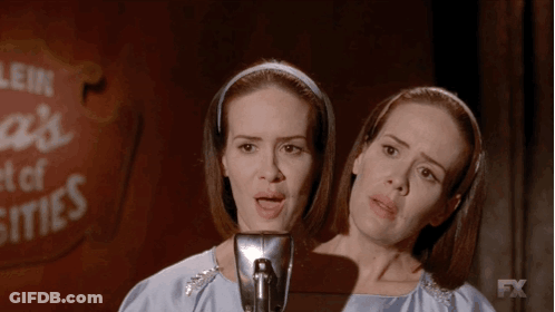 Two Women Singing Into A Microphone With A Fx Logo In The Background GIF