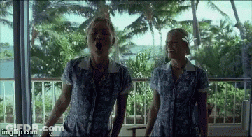 Two Women Singing On Balcony GIF