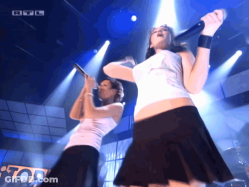 Two Women Singing On Stage RTL Logo GIF